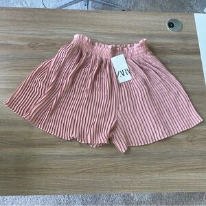 Pink pleated shorts from Zara